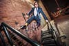 A man in a suit jumping off a wall